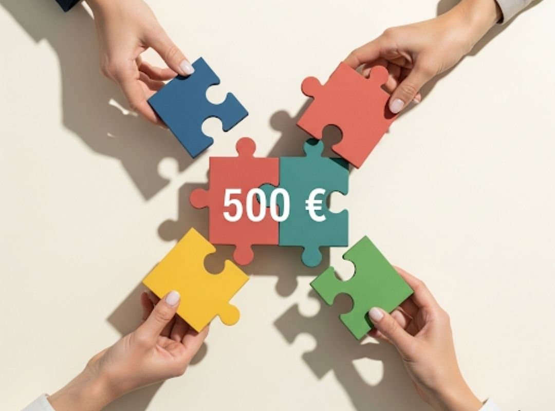 Vier Hände fügen bunte Puzzleteile zu einem Ganzen zusammen. In der Mitte steht „500 €“. Symbolbild für die Robethood Tippgemeinschaft und das sichere Startguthaben.
